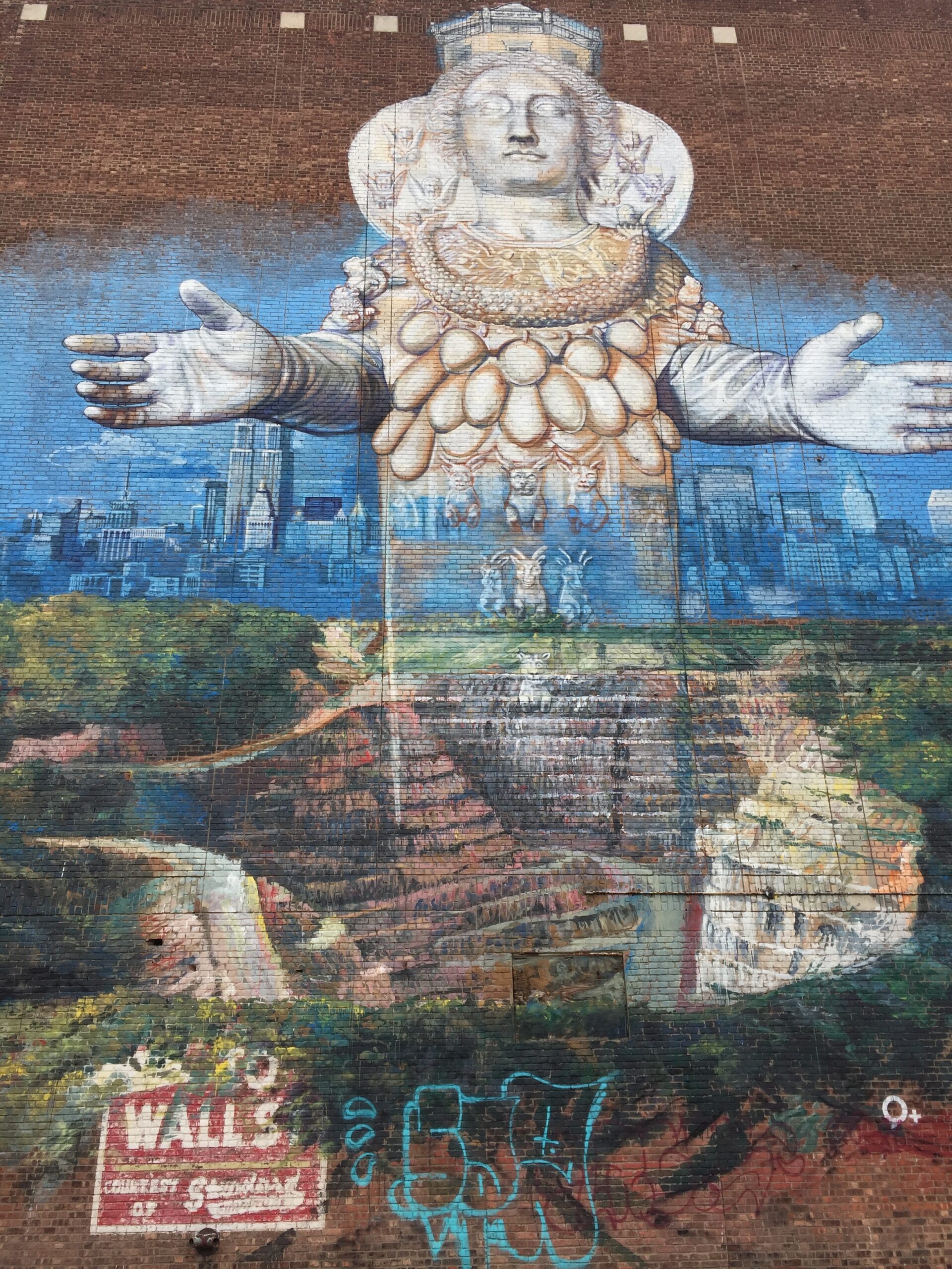Painting of a goddess holding out her hands with New York high-rise skyline behind.
